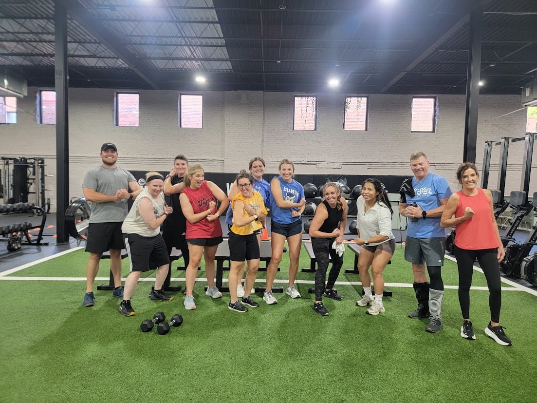 Members are welcome by a fitness class as they arrive at the gym.
